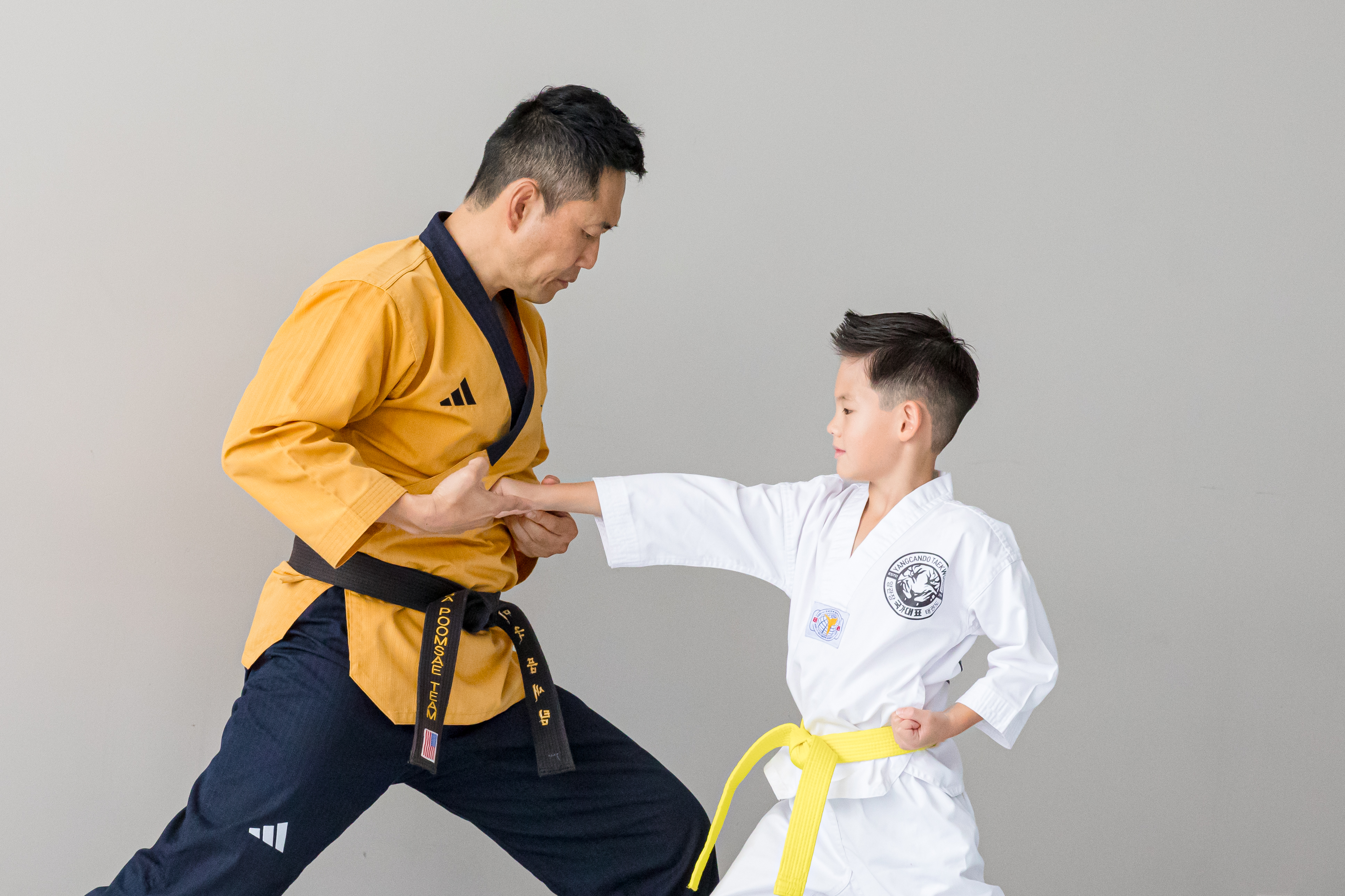 Little Tigers students practicing kicks